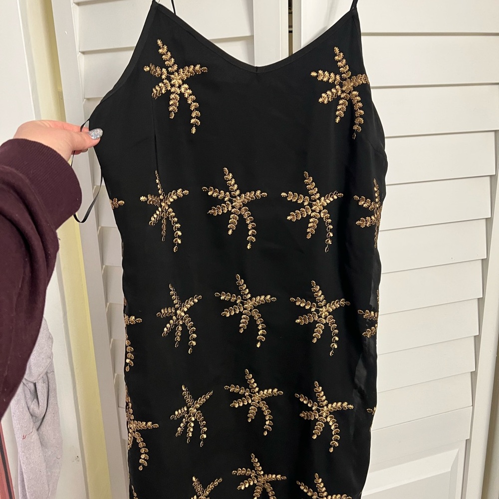 Chic Black Dress with Gold Leaf Embellishments